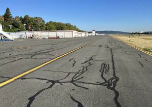 Taxiway Alpha is more than 20 years old and has many sealed cracks from years of repair. Photo provided by Manny Cruz