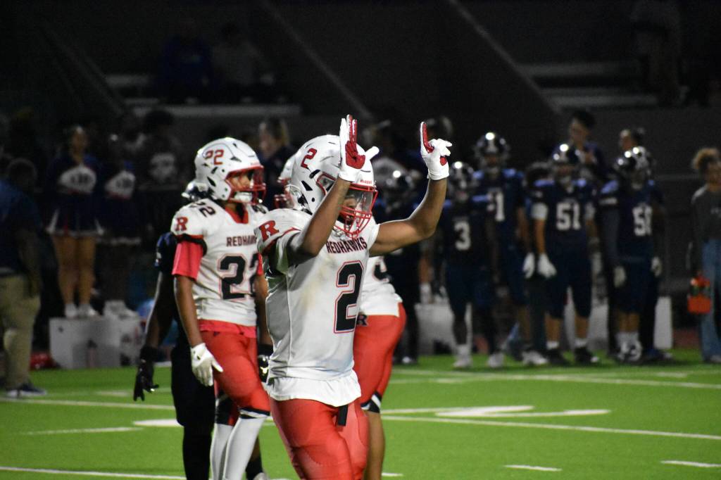 Rentons Patrick Turner holds up six fingers, one for each touchdown. Ben Ray / The Reporter