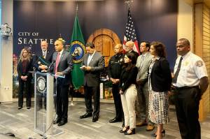 Washington state Attorney General Nick Brown speaks at a press conference alongside Seattle Mayor Bruce Harrell and other local officials on Monday, Sept. 29 at Seattle City Hall. (Photo by Jake Goldstein-Street/Washington State Standard)