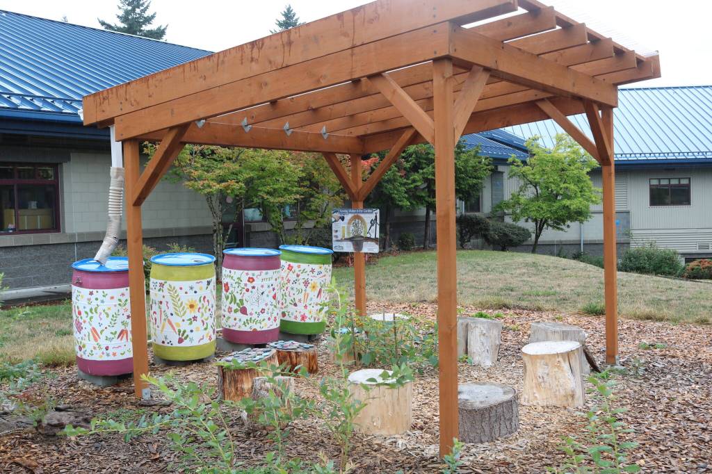 Rain barrels are the newest addition to the garden, allowing students to easily water their plants.