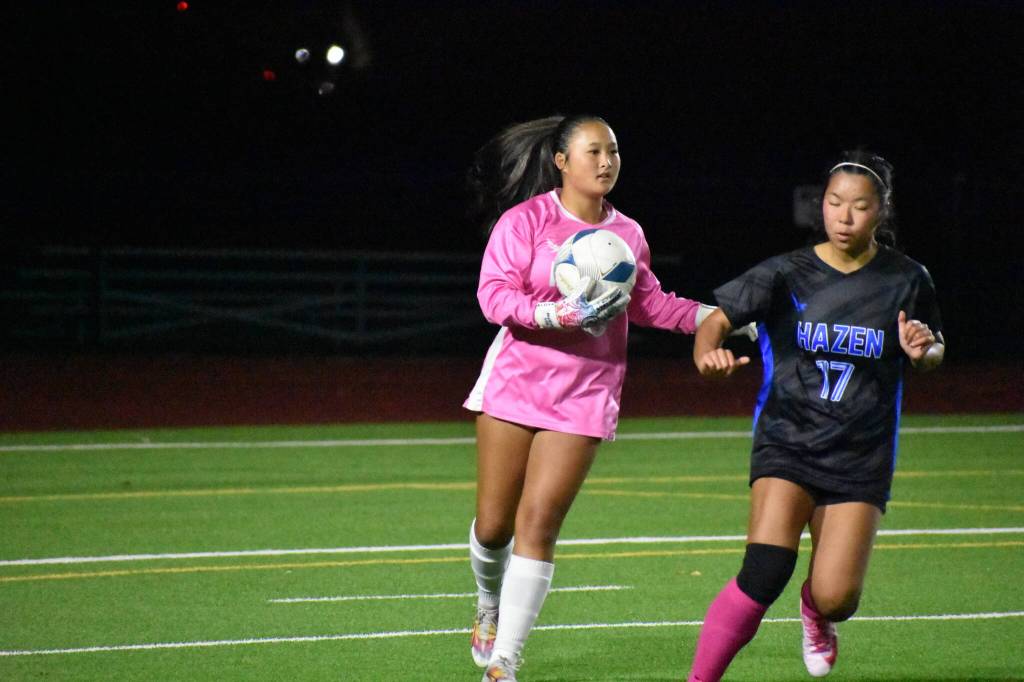 Audrey Lee holds the ball in her hands as the Hazen goalkeeper. Ben Ray / The Reporter