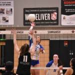 Avery Bange with a spike against Bellevue. Ben Ray / The Reporter