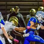 Spencer Bogh runs the ball for Liberty against Evergreen. Photo provided by Natasha Valach.