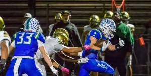 Spencer Bogh runs the ball for Liberty against Evergreen. Photo provided by Natasha Valach.