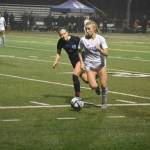 Addie Struer chases the ball down the field for Liberty against Gig Harbor. Ben Ray / The Reporter