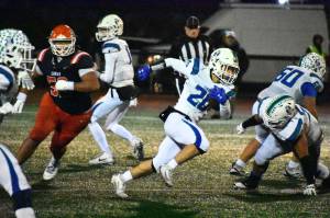 Josh Feren runs the ball for Liberty at Harry E. Lang Stadium in Lakewood. Ben Ray / The Reporter