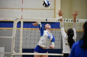 Julianne Lee goes for the kill against Bellevue. Ben Ray / The Reporter