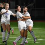 Mylene Aguila hugs Skyla Yu after her goal against Eastside Catholic. Ben Ray / The Reporter