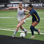 Morgan Ackermann fights off a Bellevue defender. Ben Ray / The Reporter