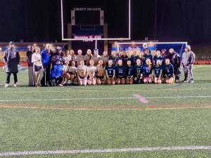 Both Graham Kapowsin and Liberty take a commemorative photo after their inaugural game in the state. Ben Ray / The Reporter