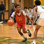 Adan Abdi dribbles the ball and impressed early in his high school debut. Ben Ray / The Reporter