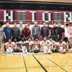 The current Renton team sits in front of the 1966-67 team, honored at halftime, and their championship banners. Ben Ray / The Reporter