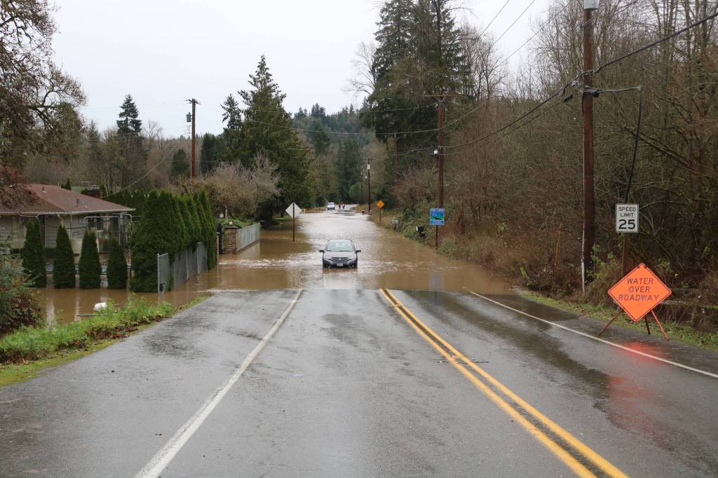 Jones Road near Cedar River has water of the roadway and filling peoples homes from the record-breaking flood. Photo by Bailey Jo Josie/Sound Publishing.