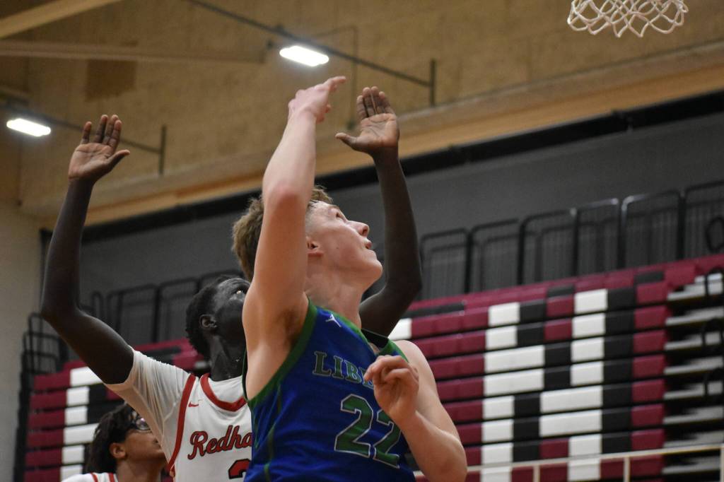 Libertys Jackson Whitaker with a lay-up against Renton. Ben Ray / The Reporter