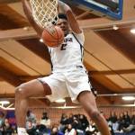 James Huff IV dunks the ball against Sequim for Lindbergh. Ben Ray / The Reporter