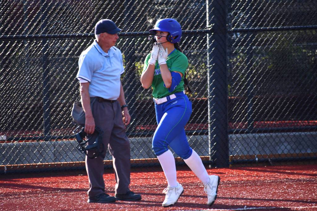 Libertys Emi Connell approaches home plate with a smile.