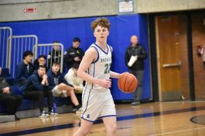 Libertys Jackson Whitaker assesses the defense against Bishop Blanchet. Ben Ray / The Reporter
Libertys Jackson Whitaker assesses the defense against Bishop Blanchet. Ben Ray / The Reporter