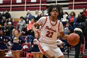 Jalen Taylor drives to the basket for Renton against Lindbergh. Ben Ray / The Reporter