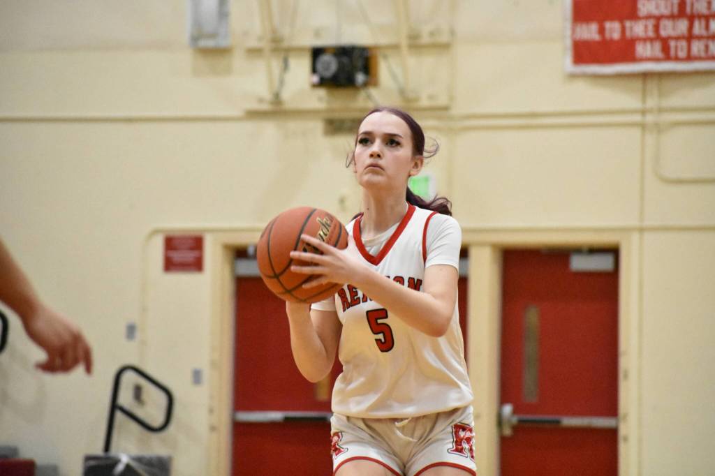 Mia Mickelson takes a three pointer for Renton. Ben Ray / The Reporter
