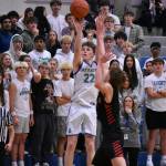 Jackson Whitaker takes a three point shot against Mount Si. Ben Ray / The Reporter