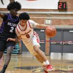 Jayden Holifield drives to the basket for Renton against Foster. Ben Ray / The Reporter