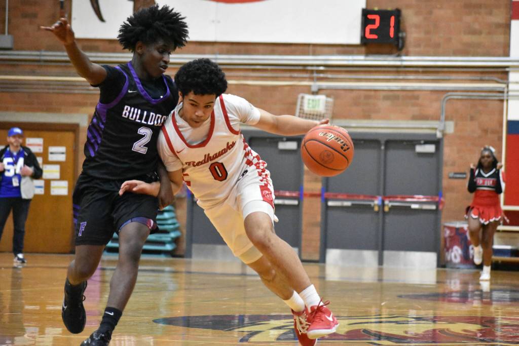 Jayden Holifield drives to the basket for Renton against Foster. Ben Ray / The Reporter