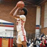 Juice White-Kelley takes a jump shot for Renton. Ben Ray / The Reporter