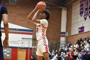 Juice White-Kelley takes a jump shot for Renton. Ben Ray / The Reporter