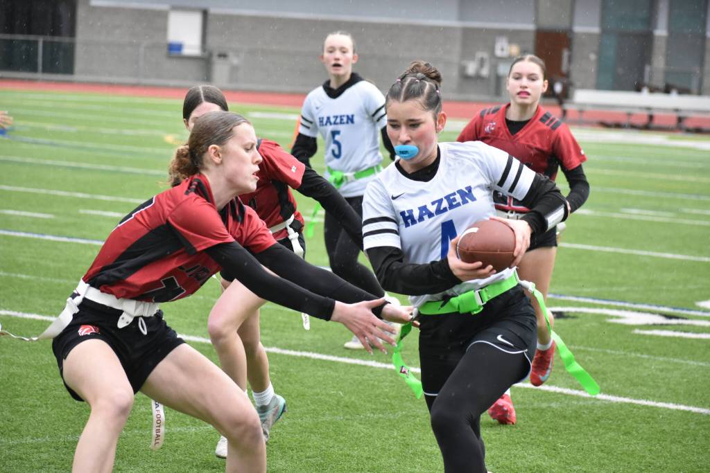 Brecken Harris tries to avoid a tackler from Lincoln.