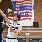 Tyler Hicks hold the finish on a 3 point shot against Chief Sealth. Ben Ray / The Reporter