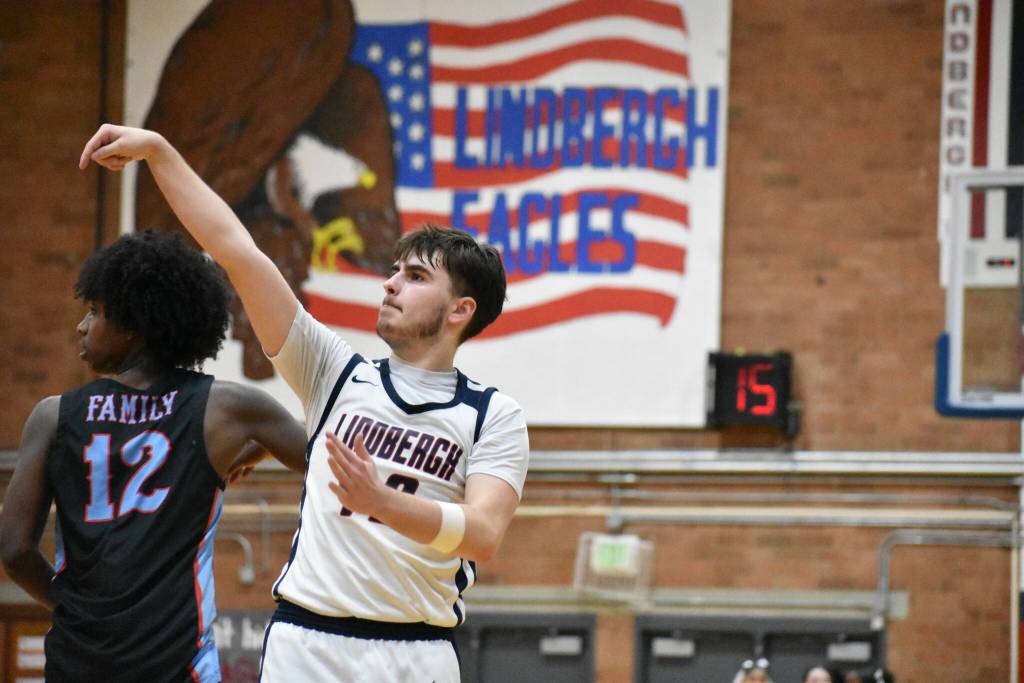Tyler Hicks hold the finish on a 3 point shot against Chief Sealth. Ben Ray / The Reporter