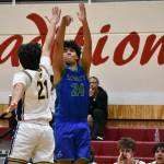 Tyson Burley takes a 3-pointer for Liberty against Bellevue. Ben Ray / The Reporter