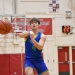 Elijah Nordland makes a pass for Liberty against Bellevue. Ben Ray / The Reporter