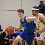 Jackson Whitaker drives to the basket for Liberty. Ben Ray / The Reporter