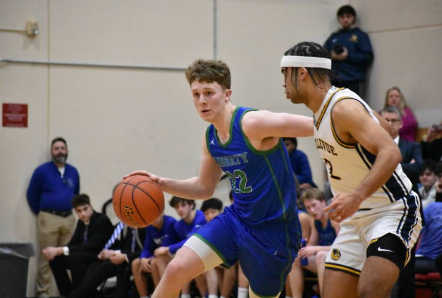 <p>Jackson Whitaker drives to the basket for Liberty. Ben Ray / The Reporter</p>