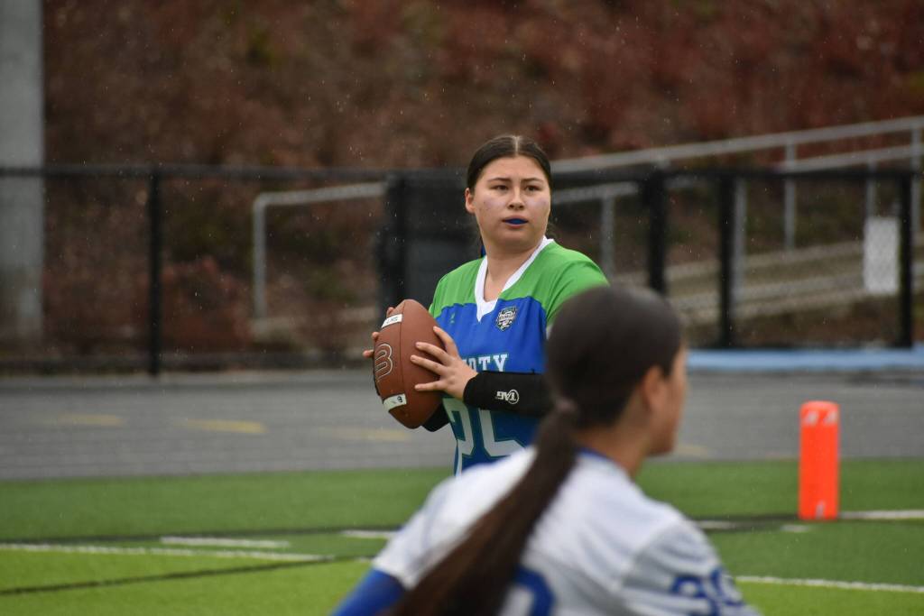 Devlyn Bird holds the ball as the quarterback for the Patriots. Ben Ray / The Reporter