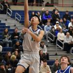 Mason Chin goes for a lay-up against Seattle Prep at Bellevue College. Ben Ray / The Reporter