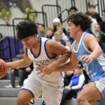 Tyson Burley drives to the basket for Liberty. Ben Ray / The Reporter