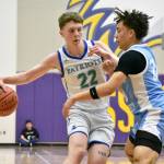 Jackson Whitaker fends off a defender from Central Valley. Ben Ray / The Reporter
