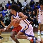 Jalen Davis drives past the Renton defender. Ben Ray / The Reporter