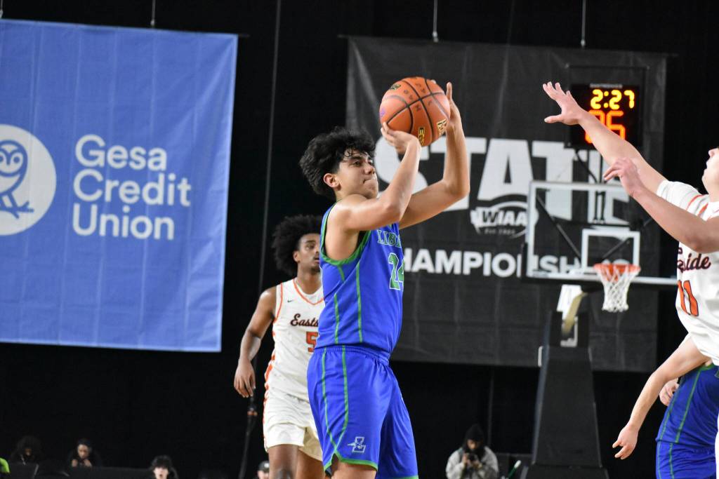 Tyson Burley takes a 3-pointer for Liberty inside the Tacoma Dome. Ben Ray / The Reporter