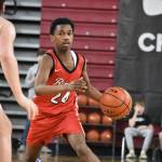 Adan Abdi dribbles the basketball for Renton. Ben Ray / The Reporter