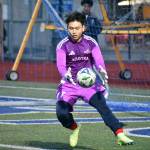 Khiem tu grabs the ball for the Lindbergh Eagles. Ben Ray / The Reporter