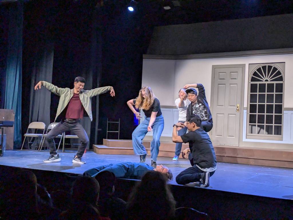 Photo by Bailey Jo Josie/Sound Publishing
The Shallow Sea was the winner of the night at Take 5 Improv Groups performance on Saturday, March 28, at the Renton Civic Theatre. The crowd was treated to five different first acts of films being shown at a film festival. Here, the actors pretend to be tiny organisms consuming a whale at the bottom of the ocean. Laughter ensues.