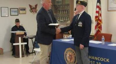 Renton Police Department Deputy Chief receiving an award on behalf of Renton Sgt. Jason Trader. Courtesy photo.