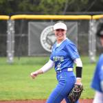 Izzy Rockey smiles as she heads out to shortstop. Ben Ray / The Reporter