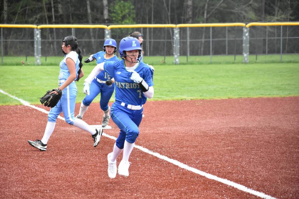 Sarah Hoki runs home for Liberty. Ben Ray / The Reporter