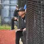 Joon Huh looks on from the dugout as Liberty head coach. Ben Ray / The Reporter