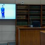 Prosecutor Elaine Lee showing a photo of Hazrat Ali Rohani. Photo by Joshua Solorzano/Sound Publishing