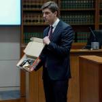 Mark Middaugh showing the jury one of the BB guns from the incident. Photo by Joshua Solorzano/Sound Publishing